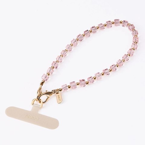 Zawieszka UNIQ Coehl Candy Gem Handstrap uniwersalny sznurek do telefonu na rękę - różowa Zawieszka UNIQ Coehl Candy Gem Handstrap uniwersalny sznurek do telefonu na rękę - różowa